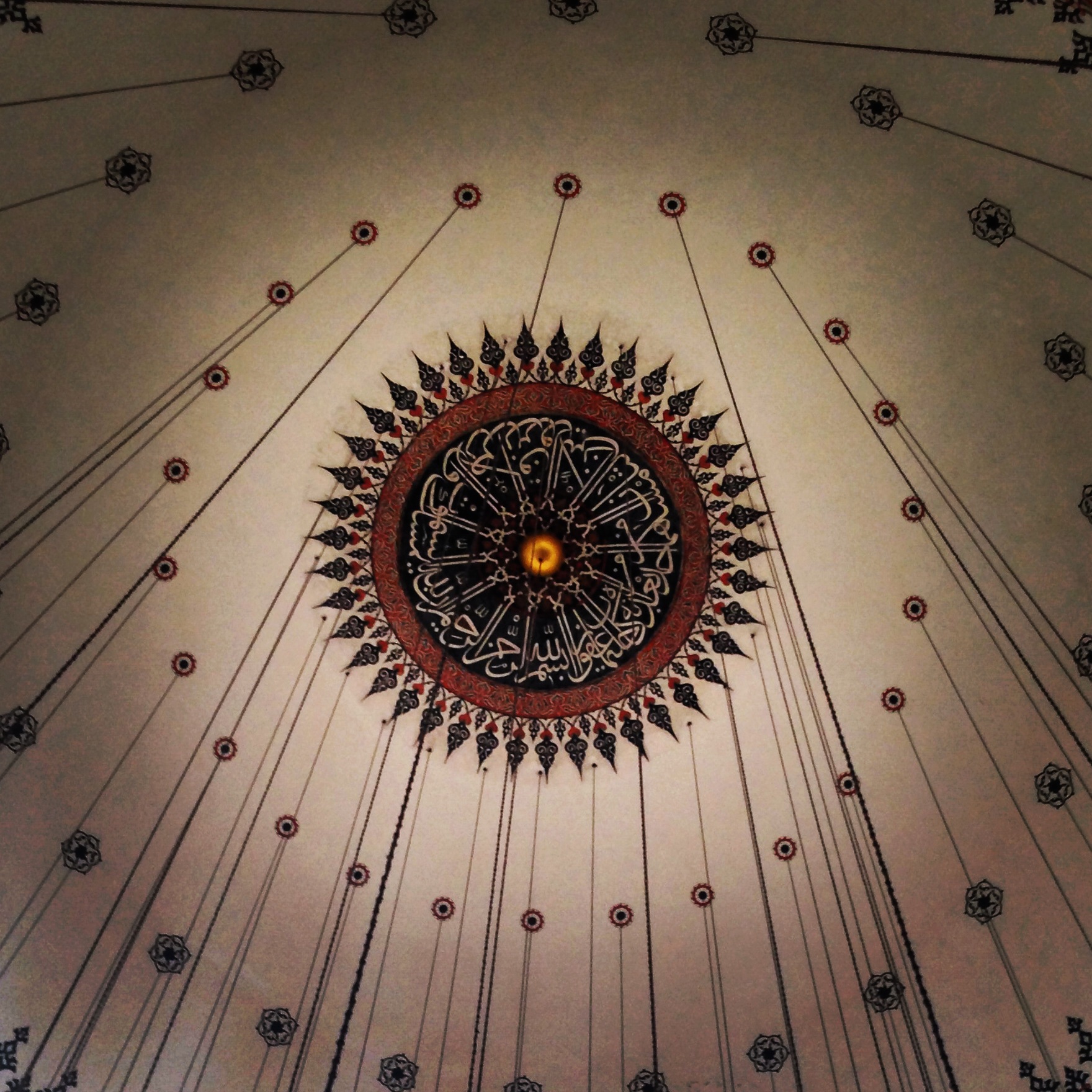 Ornate calligraphic ceiling medallion.